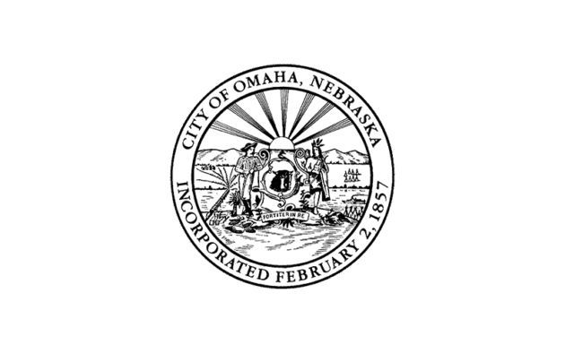 The seal of Omaha, Nebraska, depicting a pioneer scene with a steamboat, shield, and railroad, with text "City of Omaha, Nebraska Incorporated February 2, 1857.